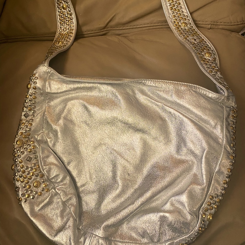 Medium size silver with some bling brand new never used